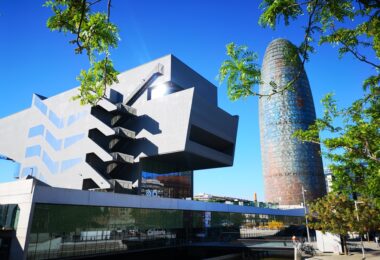 Disseny Hub Barcelona museum (design museum of Barcelona) and Agbar tower in a sunny day